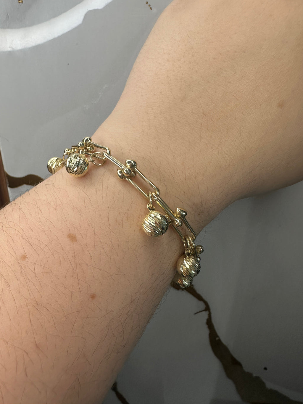 Manilla con Esferas Brillantes - Oro 10k, 7"