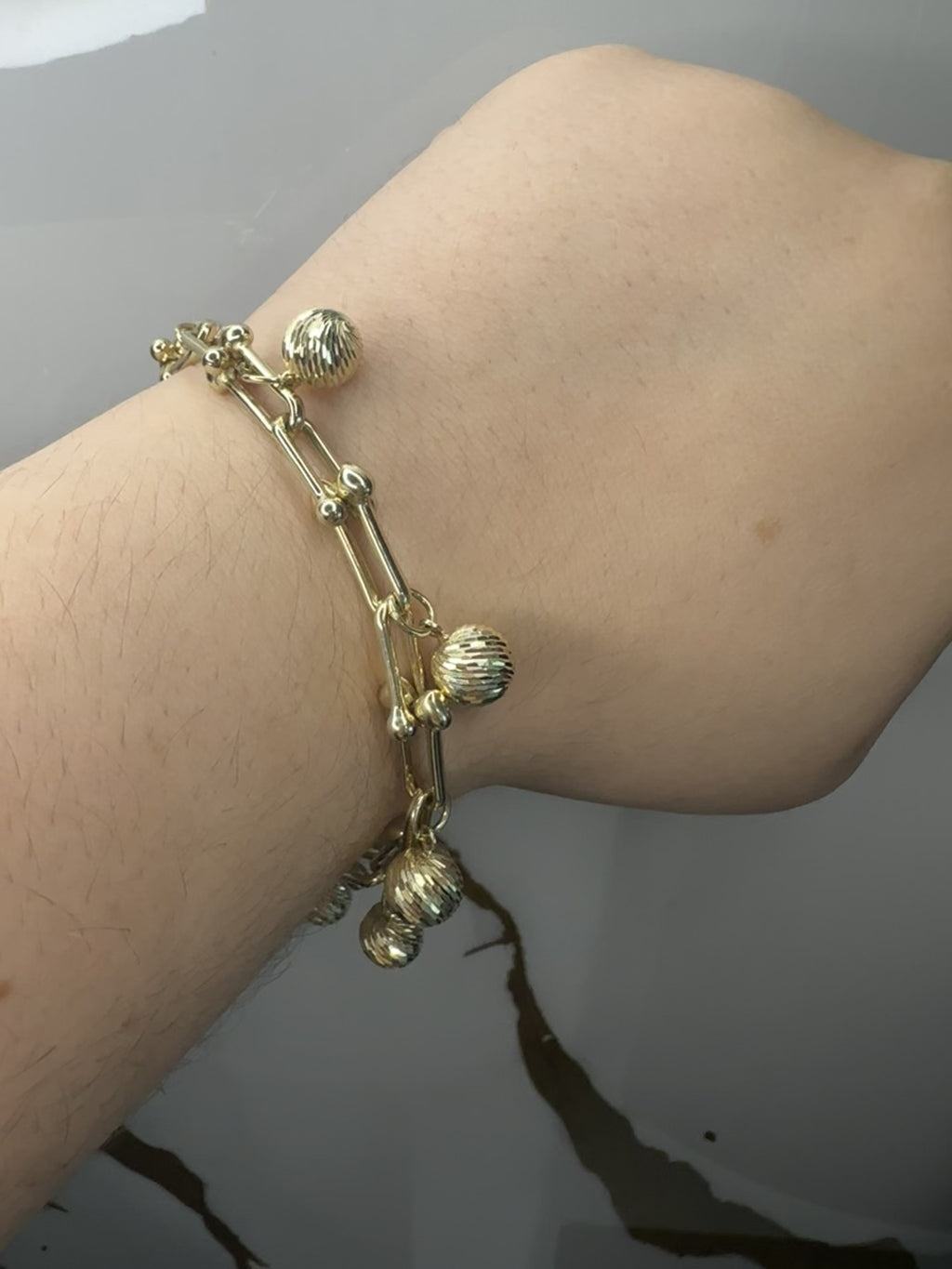 Manilla con Esferas Brillantes - Oro 10k, 7"