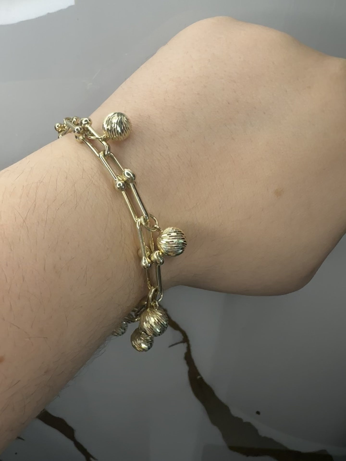 Manilla con Esferas Brillantes - Oro 10k, 7"